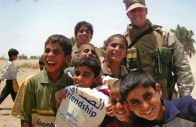 Marines passing out Spirit-of-America-provided school supplies in Ramadi, Iraq